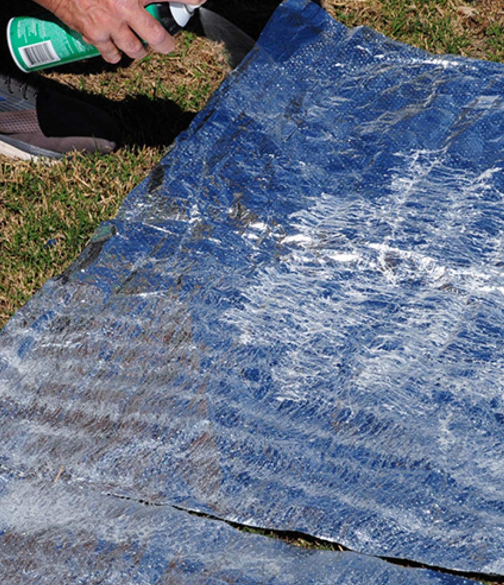 Rather than stuff the insulation back in place, we decided that gluing the aluminum