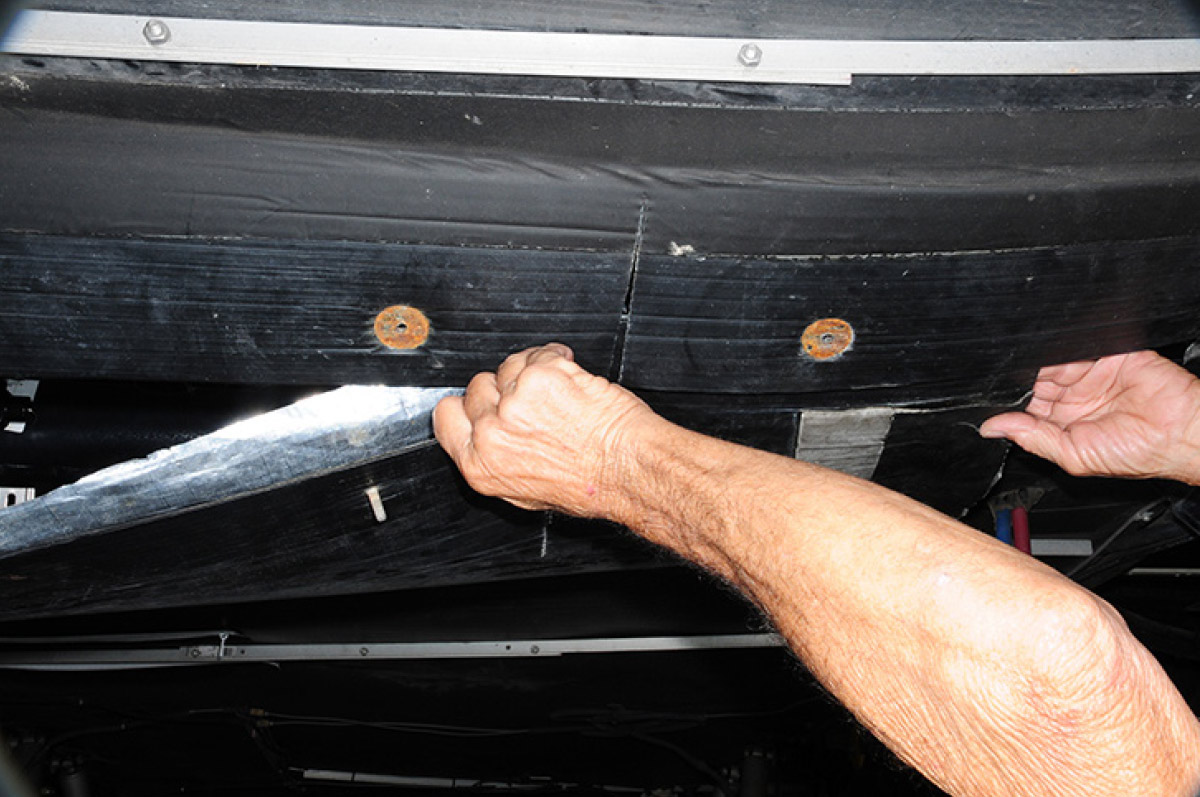 Opening the original access flap in the belly pan required unbolting the seam