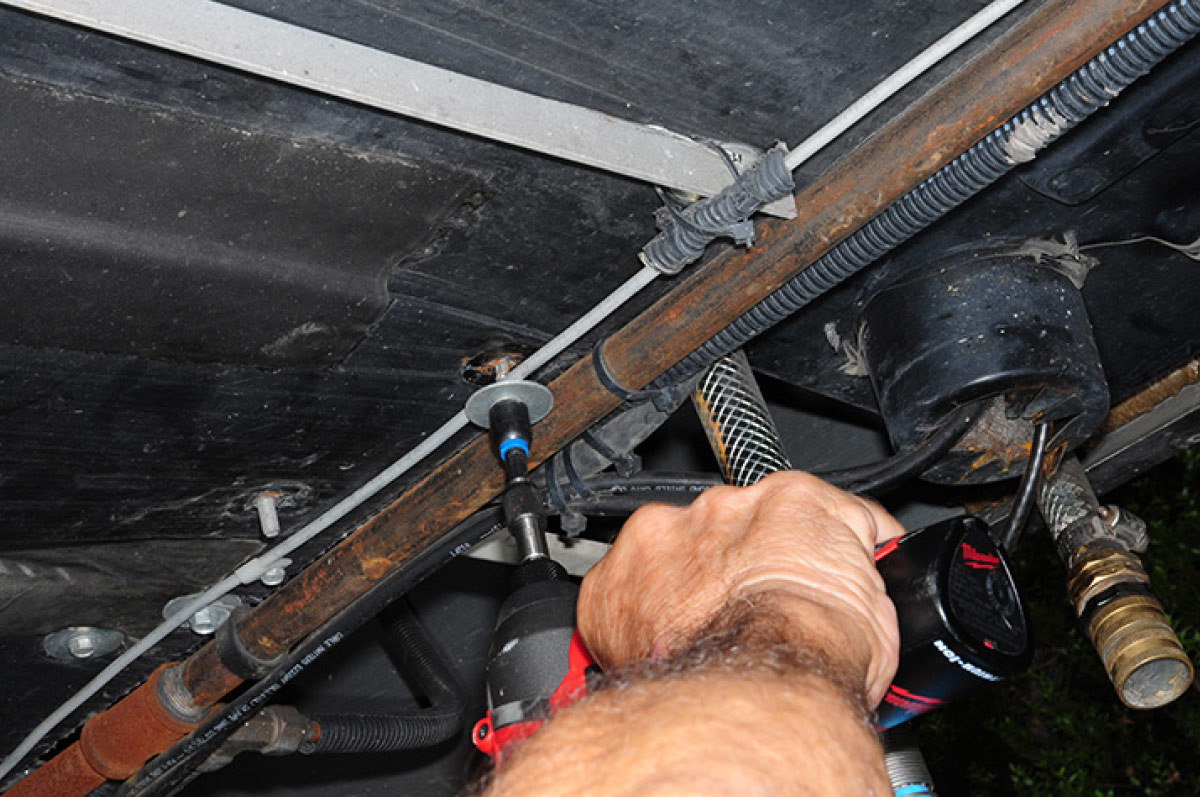 It was also necessary to unbolt the edges of the material from the chassis, which was not fun