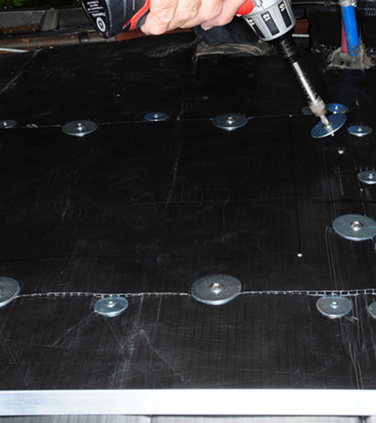 The new access panels are held in place with multiple truss head, stainless-steel