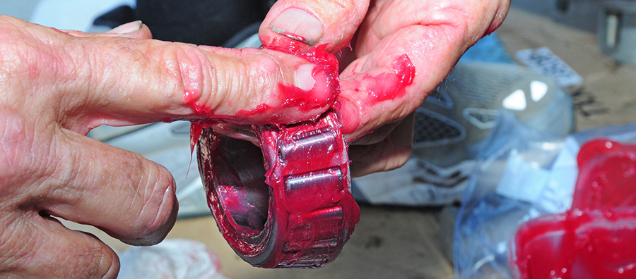 hand applying jelly to a RV part
