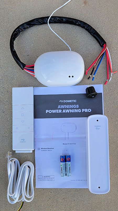 Dometic’s Power Awning Pro Kit is comprised of a wireless sensor, remote, control module and instructions