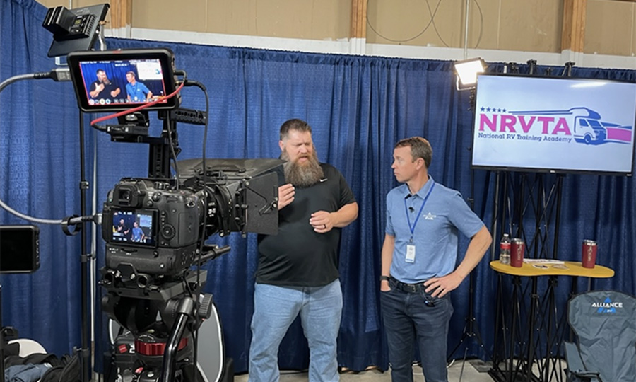 NRVTA Director of Education Todd Henson, left, with Alliance RV co-founder Coley Brady during the Alliance RV National Rally. 