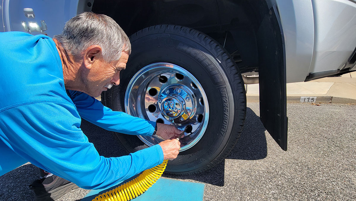 Replacing the hard-to-reach factory valve stems in dual-rear-wheels with Borg extensions civilizes the process of checking pressure and inflating tires