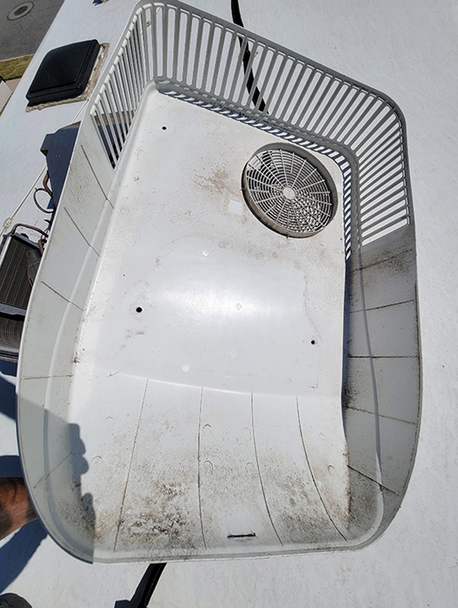 Before replacing the shroud, take the time to clean the underside of any dirt and dust
