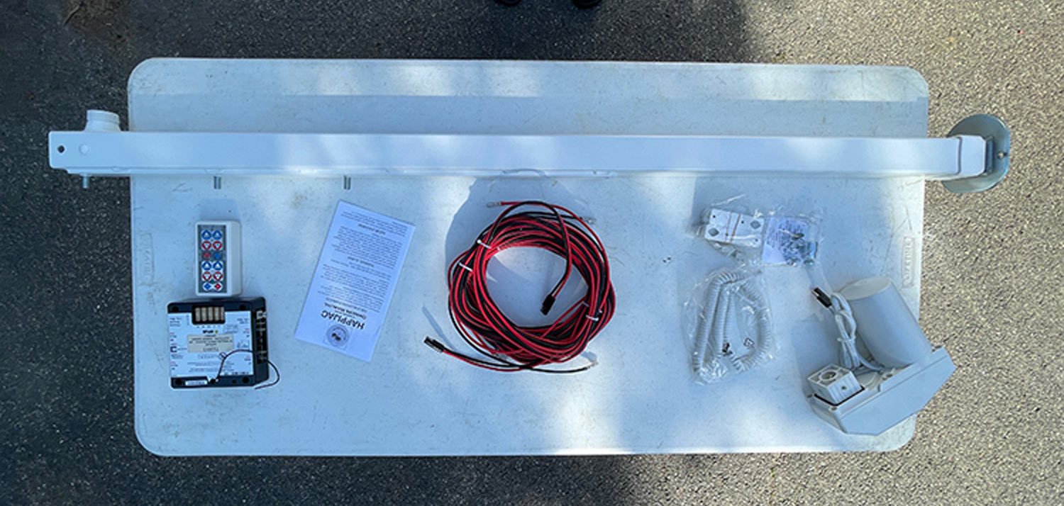 parts from the Happijac system are laid out on a table