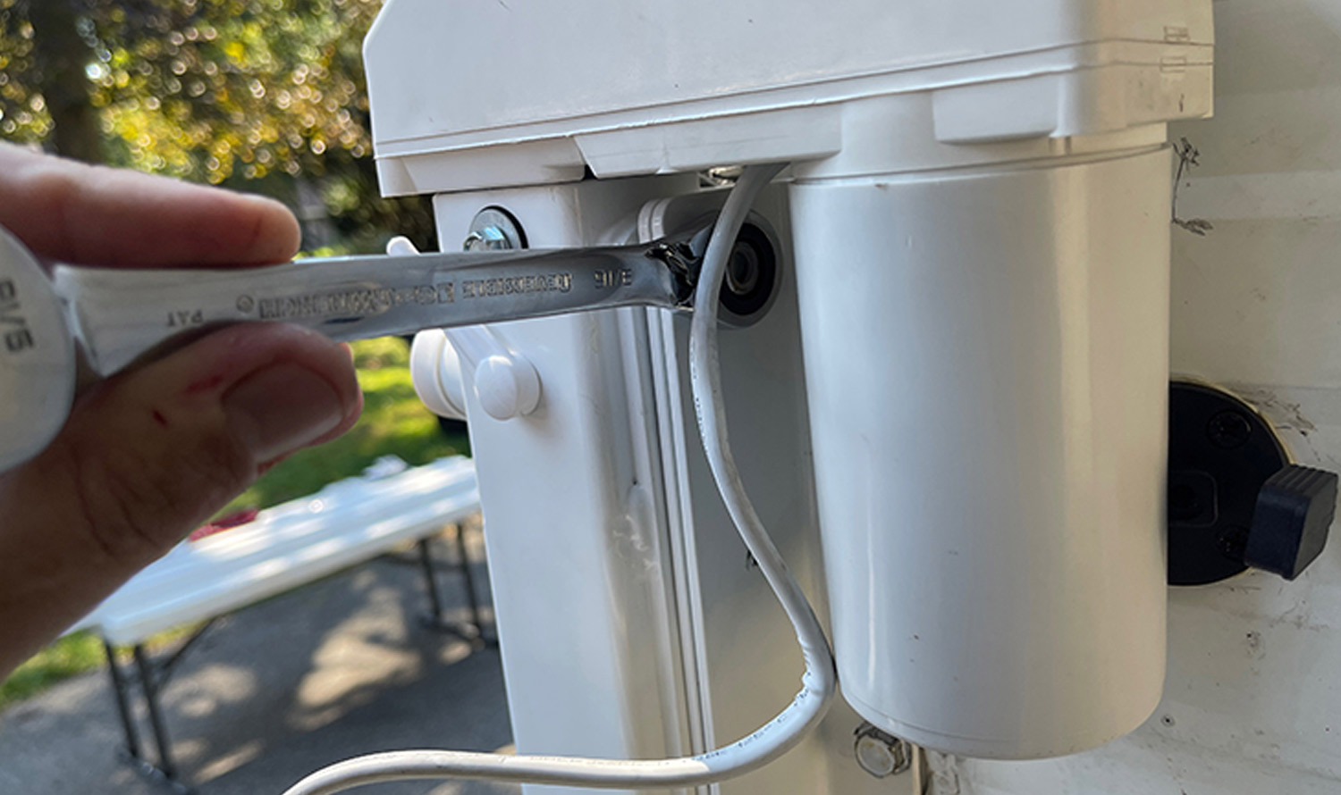mechanic tightens a Nyloc nut during the mounting process