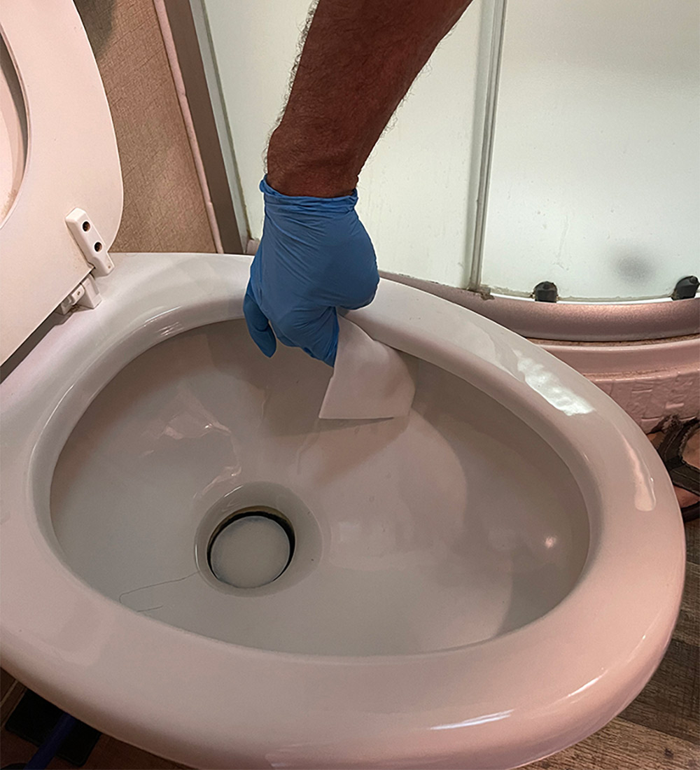 Cleaning inside of toilet bowl with Magic Eraser
