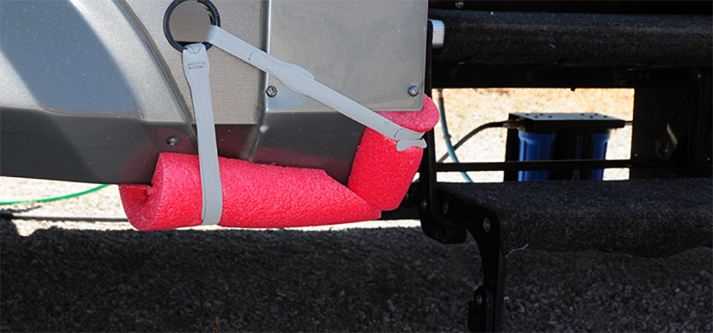 Pool noodle strapped to other slideout corner