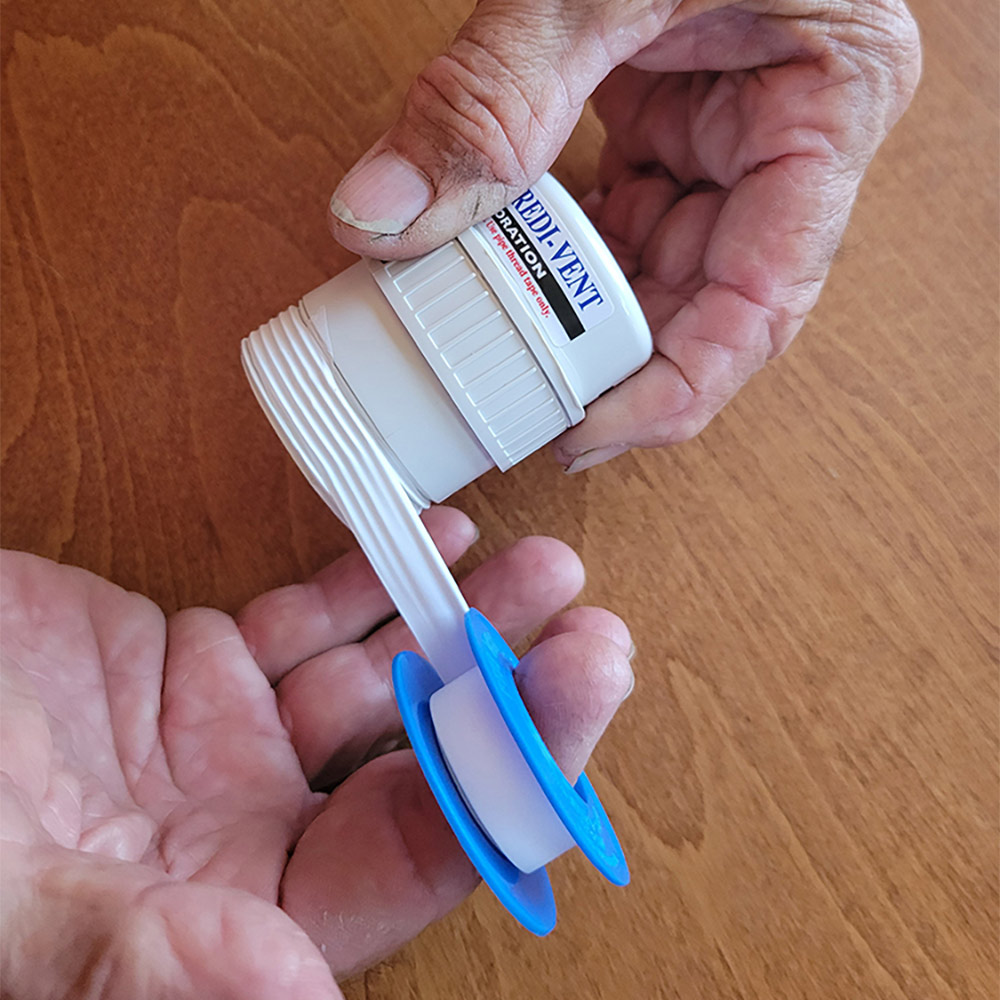 Wrapping new check vent threads with teflon tape