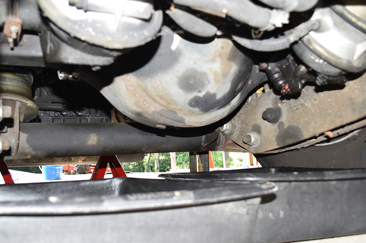 Two large pans under the rear axle to capture the old oil