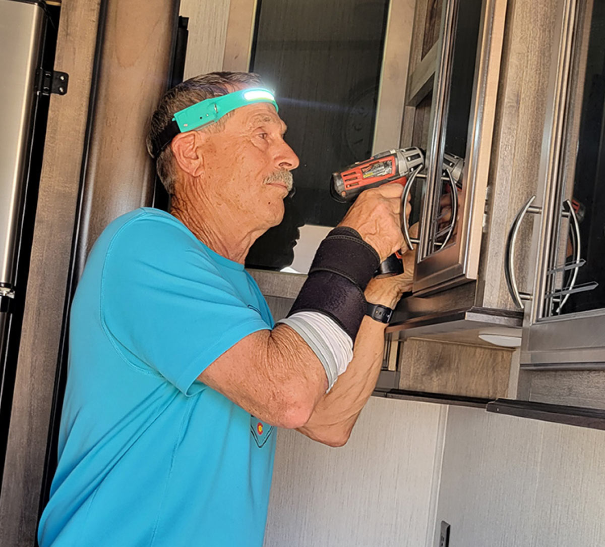 Tech Director Bill Gehr dons the headlamp he purchased from a different source