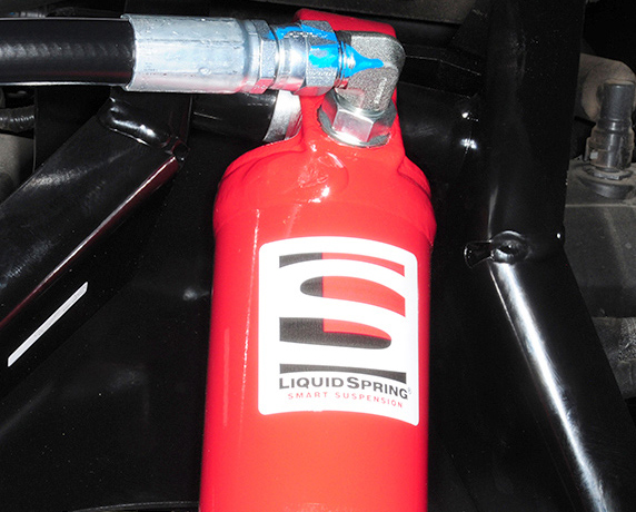 hydraulic hoses connected to the struts