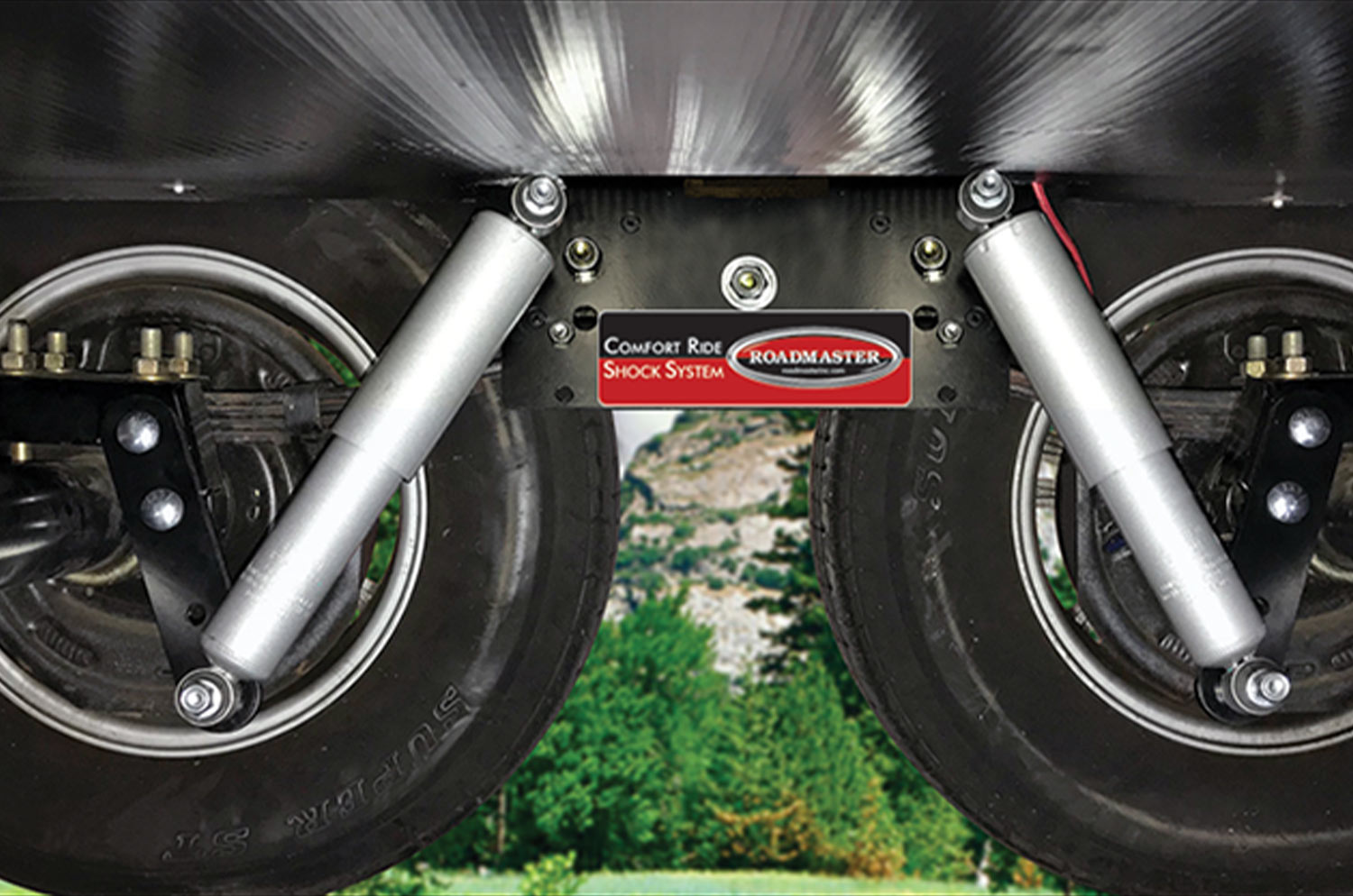 a rendered image of patented brackets allowing the shocks to be mounted vertically and angled to the outside
