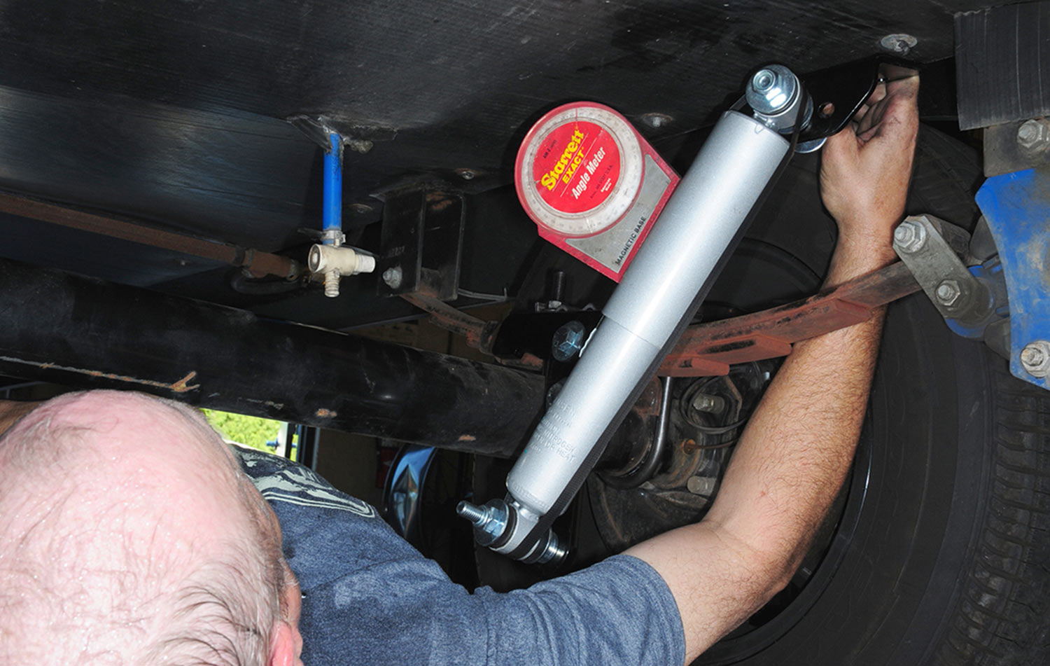 a magnetic angle meter is “stuck” to the shock housing to determine the proper angle (optimum 30 degrees) for mounting the frame bracket