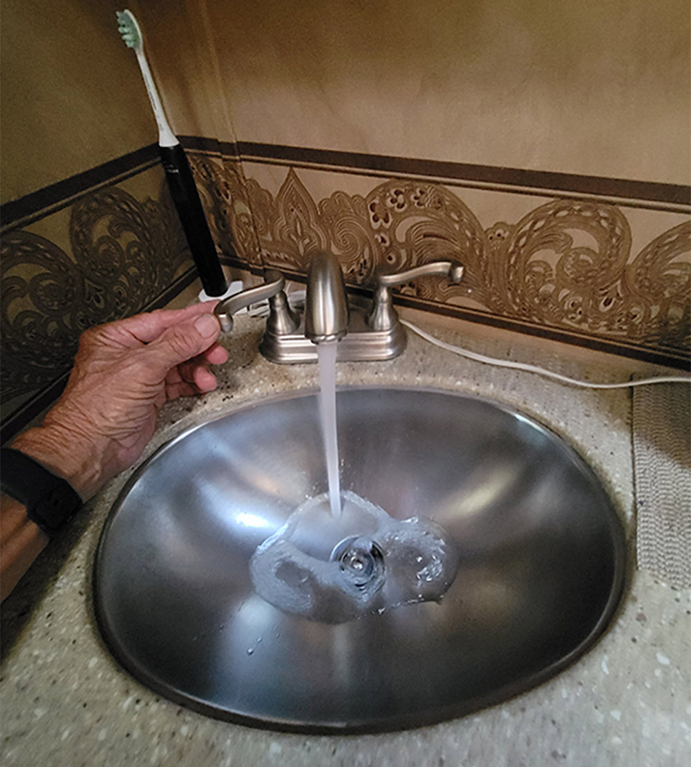 Running sink in RV to mix Purogene and sanitize pipes