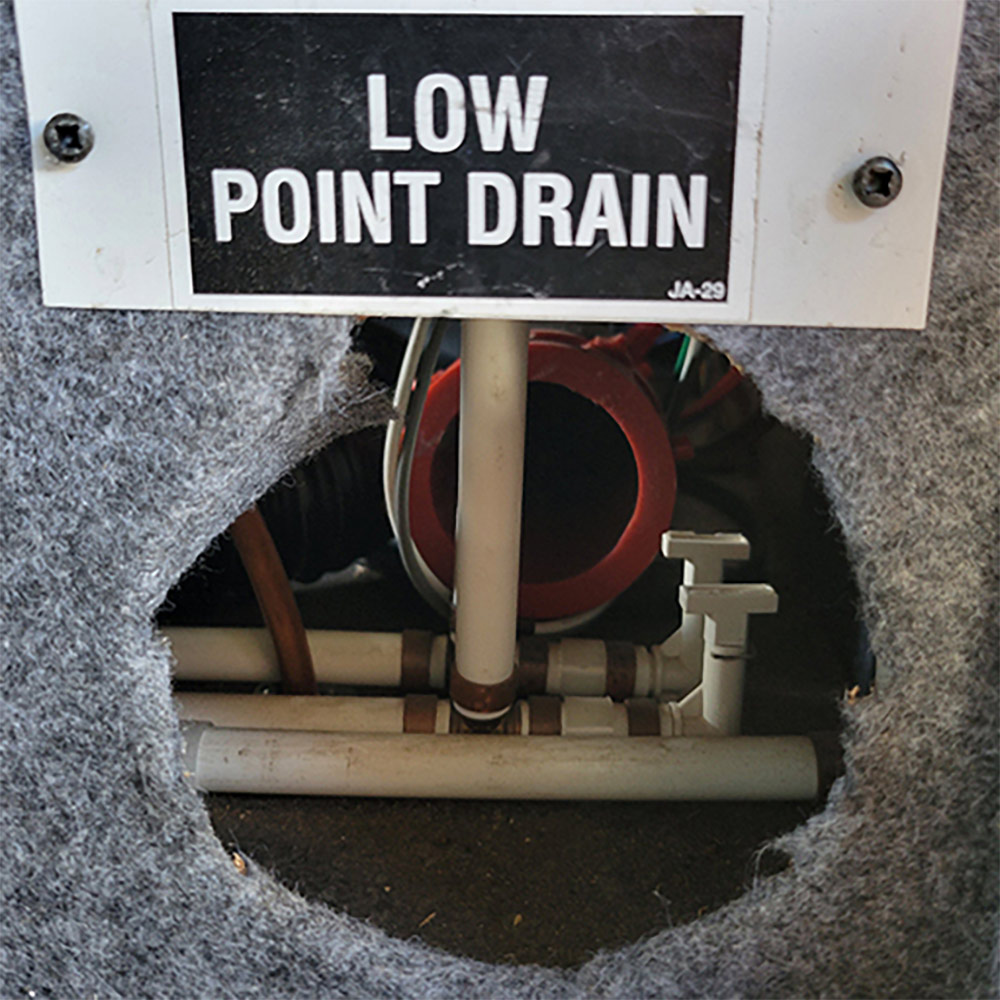 Low point drain hole