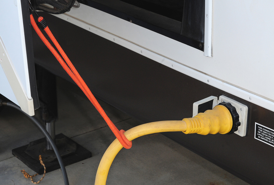 Power cords that are connected to the side of the RV