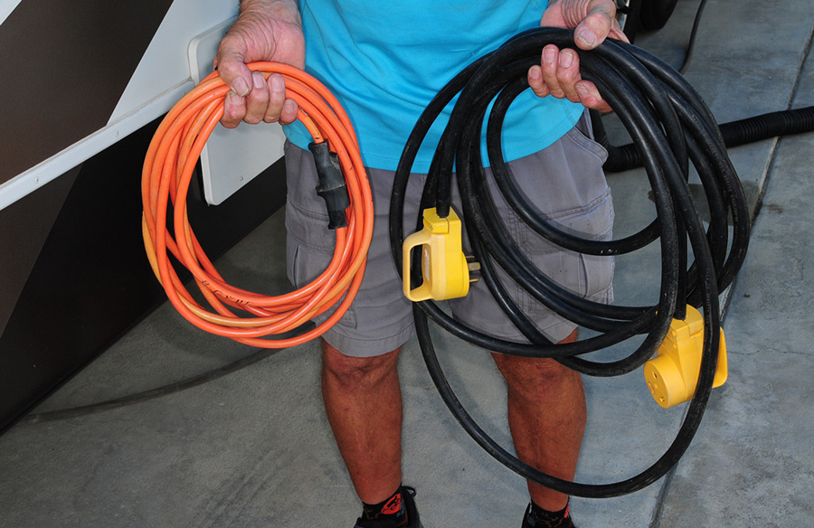 one orange and one black extension cords