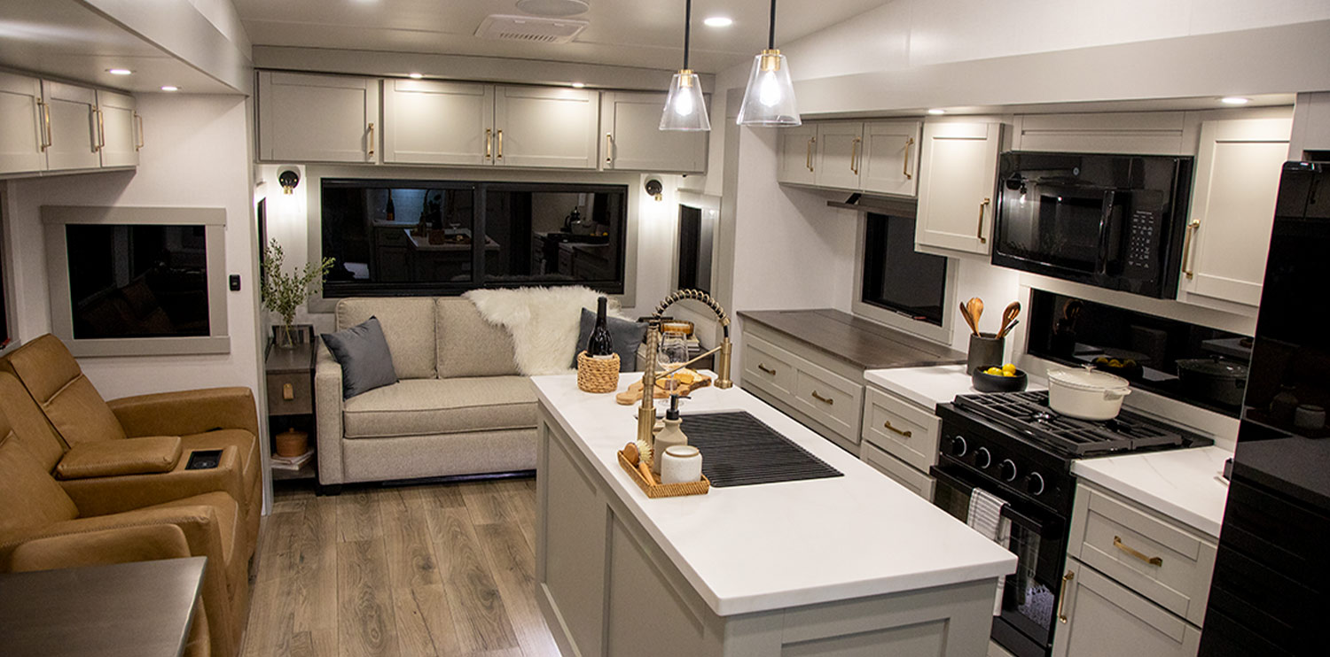 interior view of the Brinkley RV “Model Z” featuring a full kitchen and seating areas