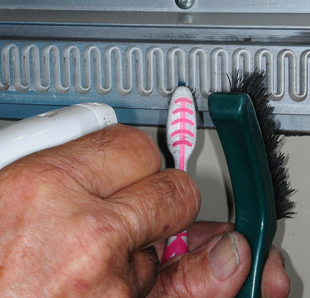 use a good cleaner and a toothbrush or stiff-bristle brush