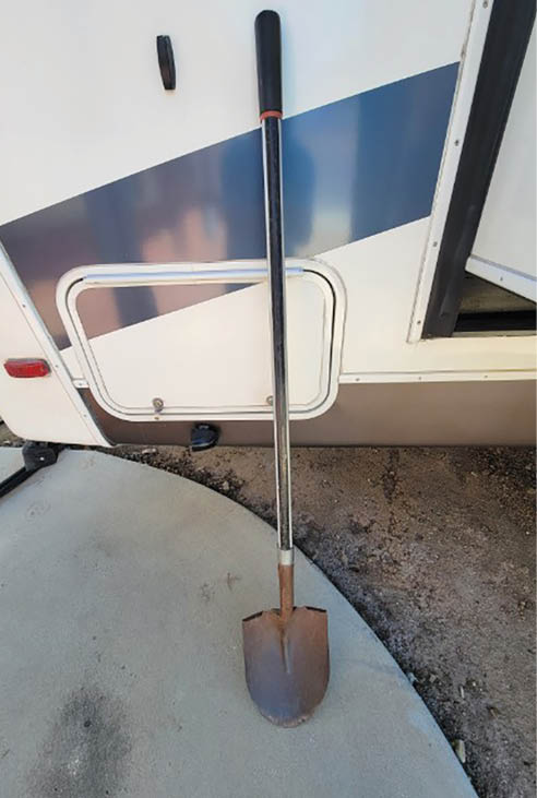 Shovel leaned against RV