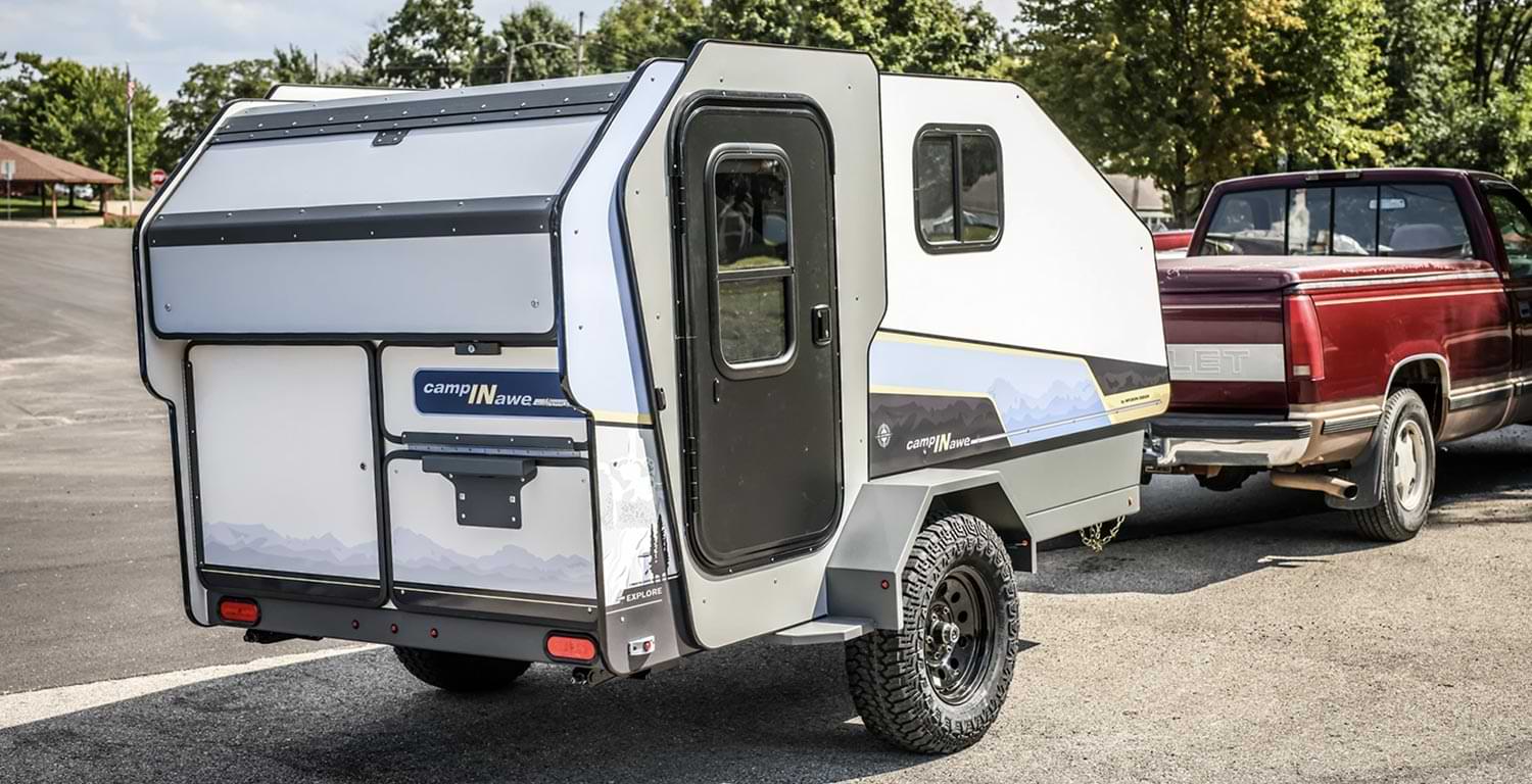 a trailer hitched to a red truck