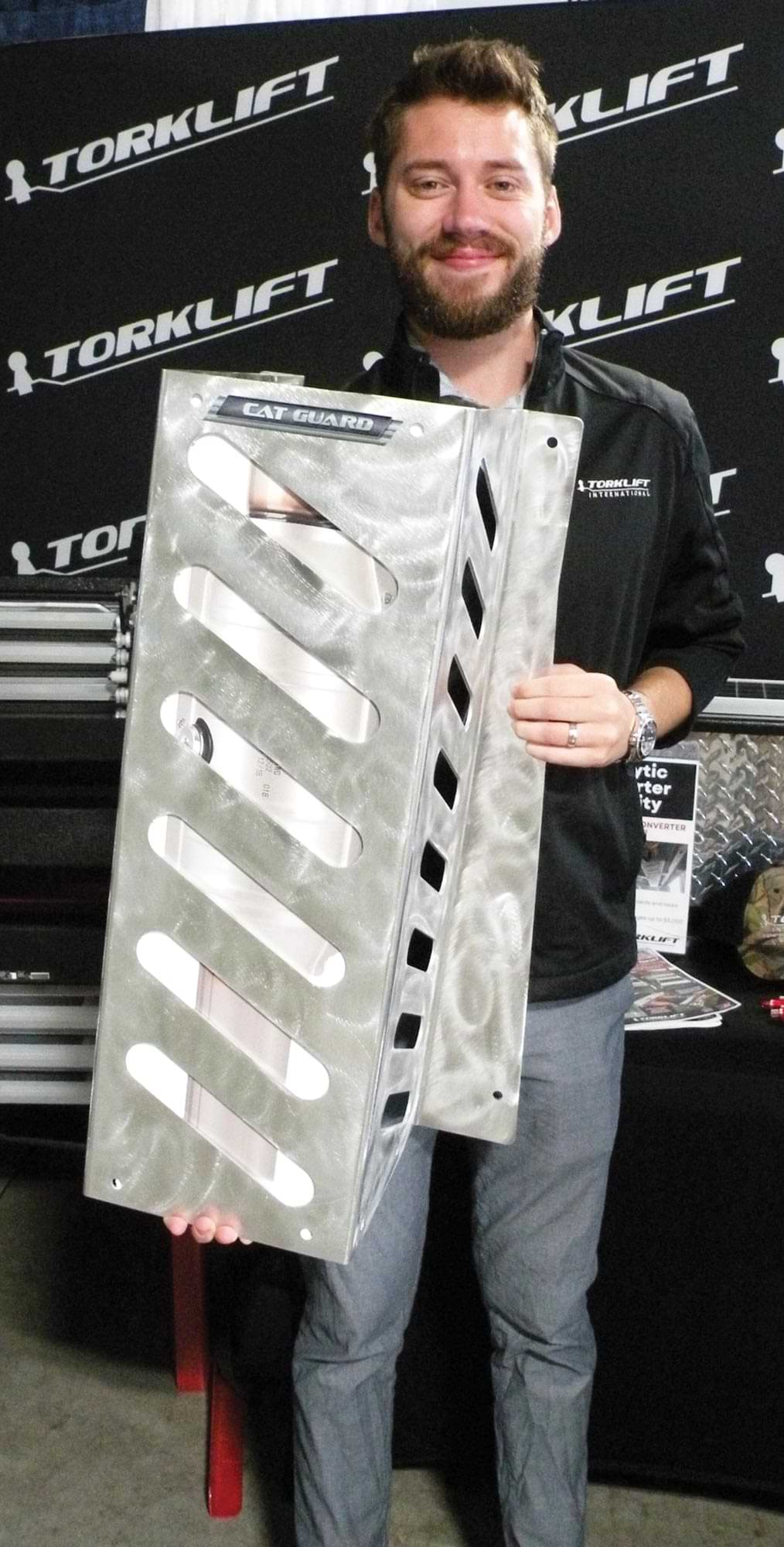 a man holds the Cat Guard protection system from Torklift