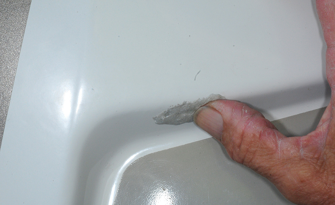 putty being applied to whole