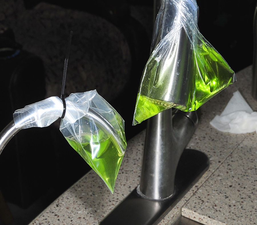 Cable ties held the bags on their respective faucets so that the offending deposits could remain dunked in the liquid for at least an hour. This method made it possible to let the cleaner do its magic without someone watching over the process or removing the spray head and faucet.