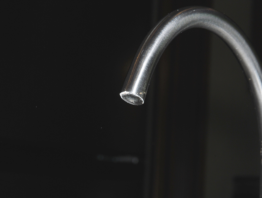 After — “Mission impossible” turned into “Mission accomplished” after the faucets took a bath in the CLR cleaner. Although there were a few tiny spots remaining on the purified water spigot (which were almost imperceptible), the cleaning restored the original look and opened the end to improve water flow.