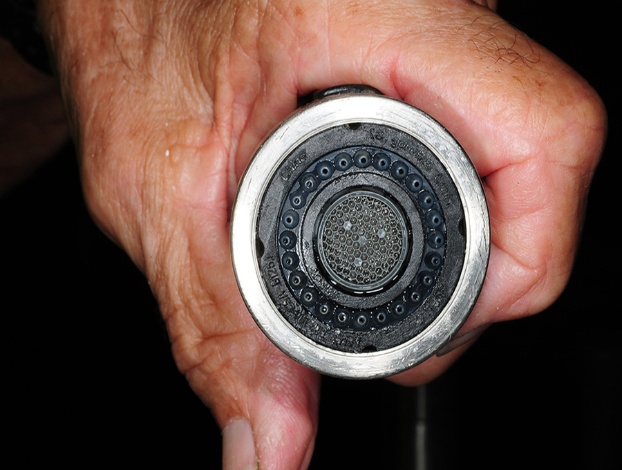After — “Mission impossible” turned into “Mission accomplished” after the faucets took a bath in the CLR cleaner. Although there were a few tiny spots remaining on the purified water spigot (which were almost imperceptible), the cleaning restored the original look and opened the end to improve water flow.