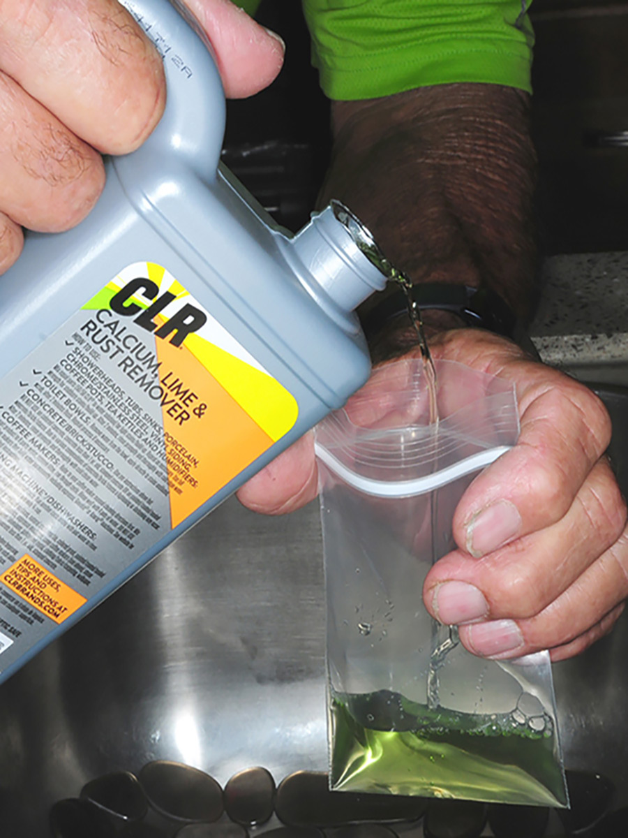 Two small Ziploc storage bags were partially filled with CLR Calcium, Lime & Rust remover before placing over the spray head and water purifier spigot in the kitchen. CLR is 80% plant-based so it’s relatively safe to use (can even be used to clean coffee pots), but thorough rinsing after use is still in order.