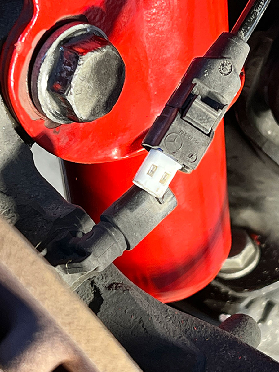 the ABS sensor wiring is plugged and reattached to the strut