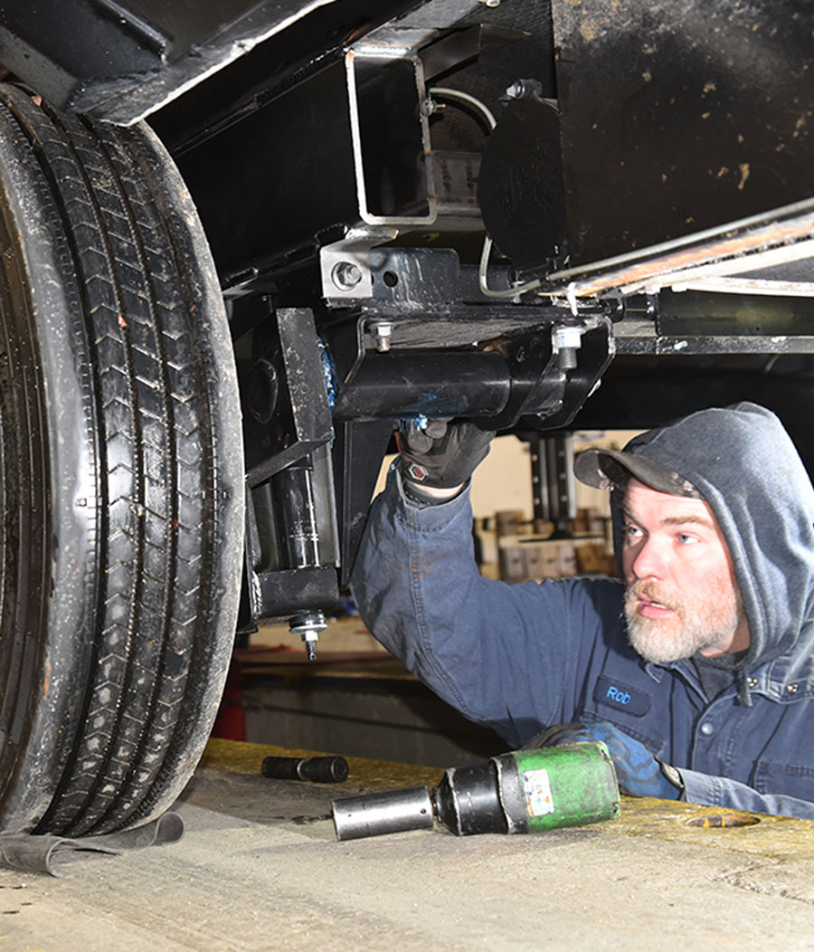 man working on a suspension
