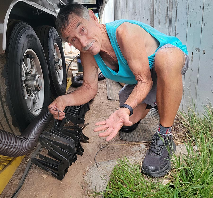man working on RV tires