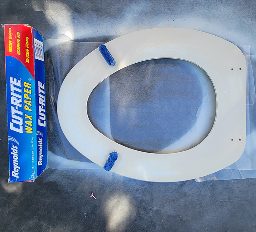 Wax paper under a toilet seat 