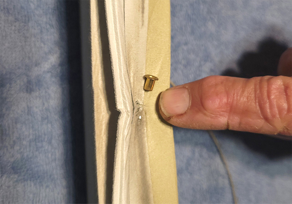 Protective metal collar in blinds for cord
