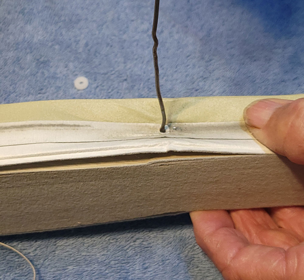 Pulling new cord through blind