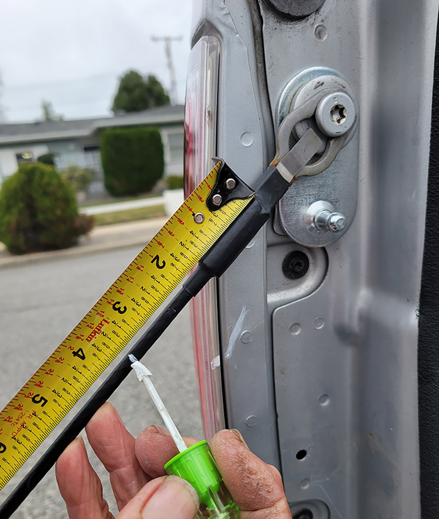 Measure 3 ½ inches from the upper end of the cable and mark the location for installing the cable clip provided in the kit. This clip provides rigidity to prevent the cable from getting tangled in the strut. After struggling to snap it over the cable (with pliers) a shot of WD-40 helped reduce friction — but it still needed a bit of persuasion.