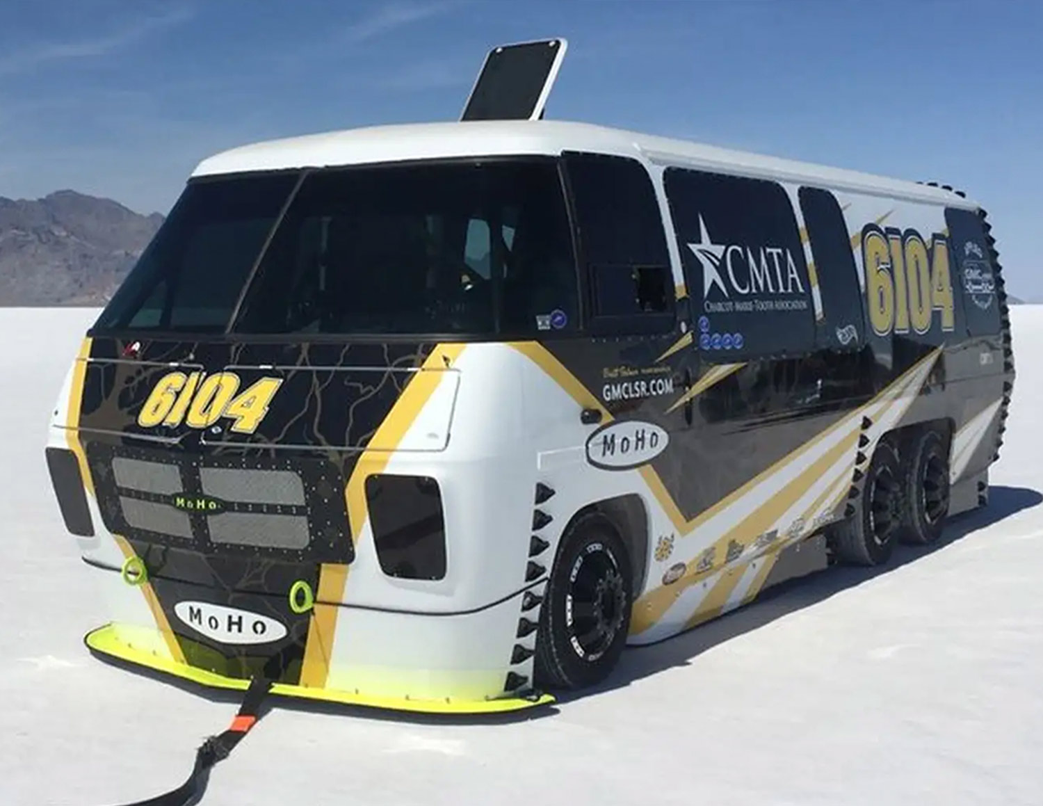 three quarter view of a GMC motorhome parked on the Bonneville Salt Flats