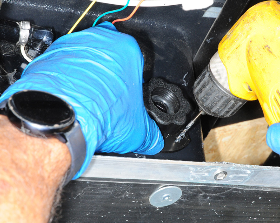 Holes being drilled through the flange in the marked position