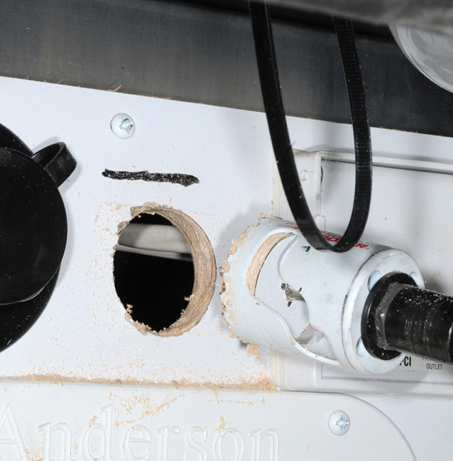hole being cut to allow for flush mounting of the 3-inch flange