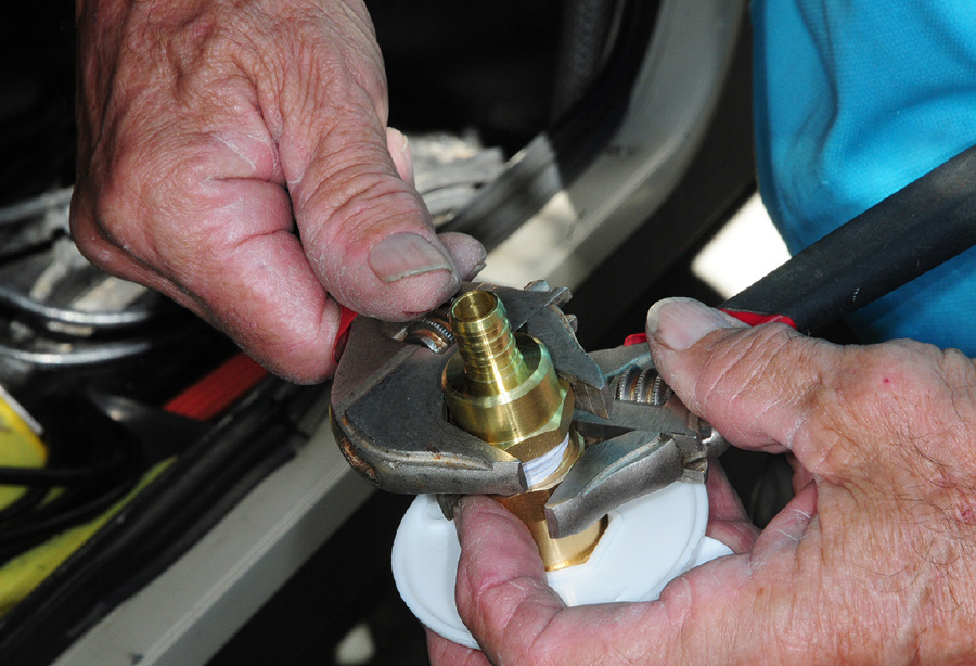 the ½-inch Pex nipple to ½-inch NPT female fitting being attached to the city water fill