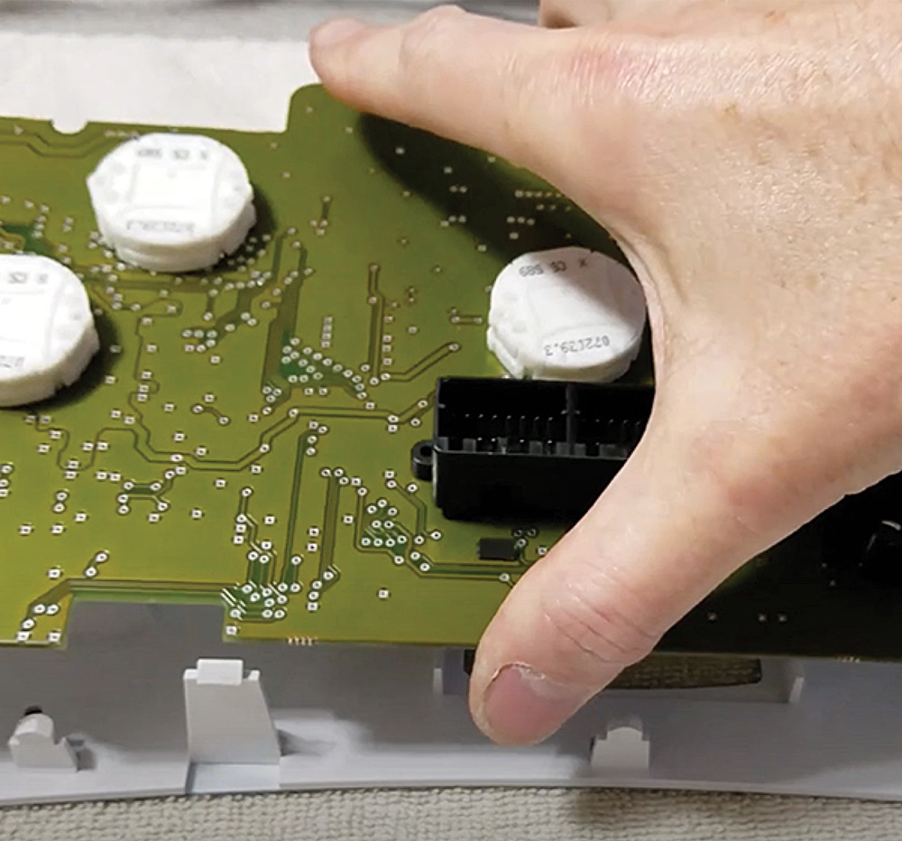 Placing circuit board back into plastic housing