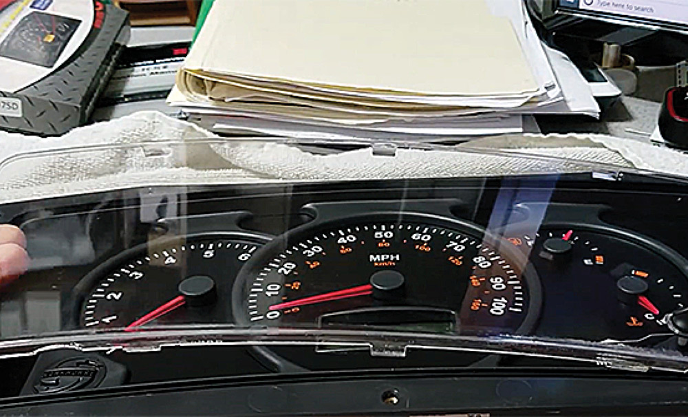 Removing gauge cluster lens cover