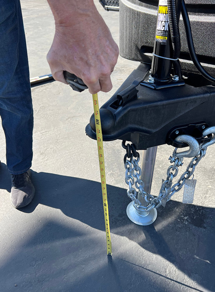 Once the trailer is level, a measurement is taken from the top of the A-frame coupler to the ground. This figure will be needed to establish the proper position of the hitch head when mounting on the shank.