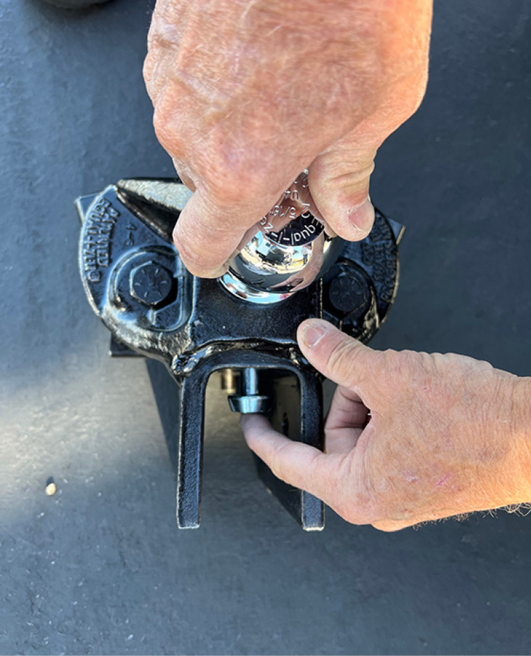 a soacer rivet is used to adjust angle of the hitch head