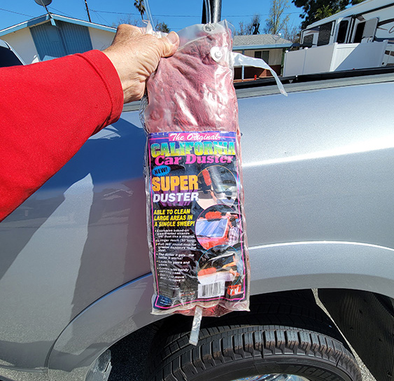arm holding The Original California Car Duster