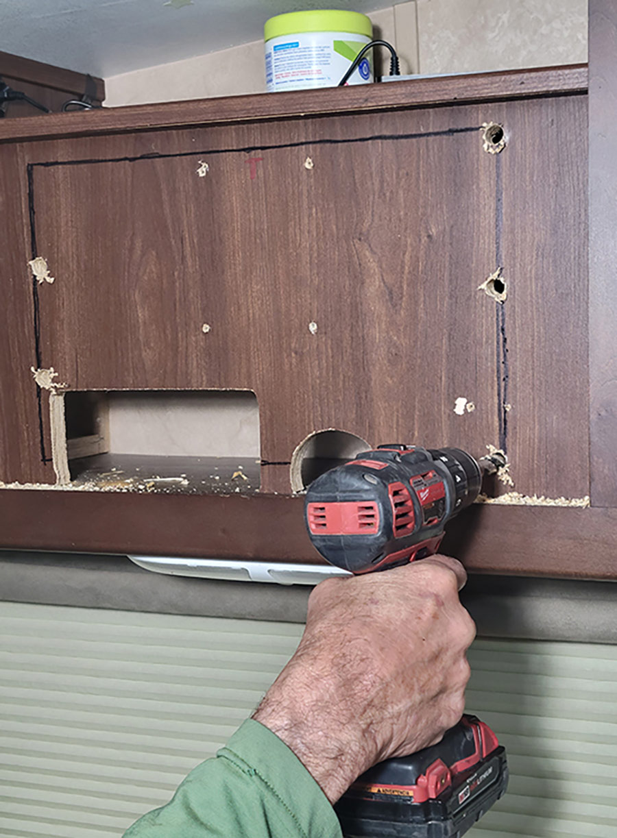 After marking the outline for the cutout, large holes were drilled in several places to make room for the jigsaw blade when cutting in different directions.
